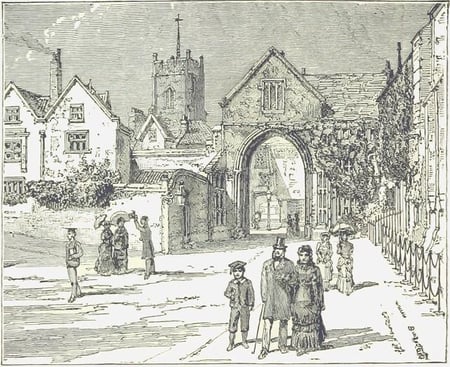 People walking at Cathedral Close with Erpingham Gate in background.
